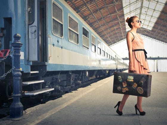 woman-with-suitcase-train-platform